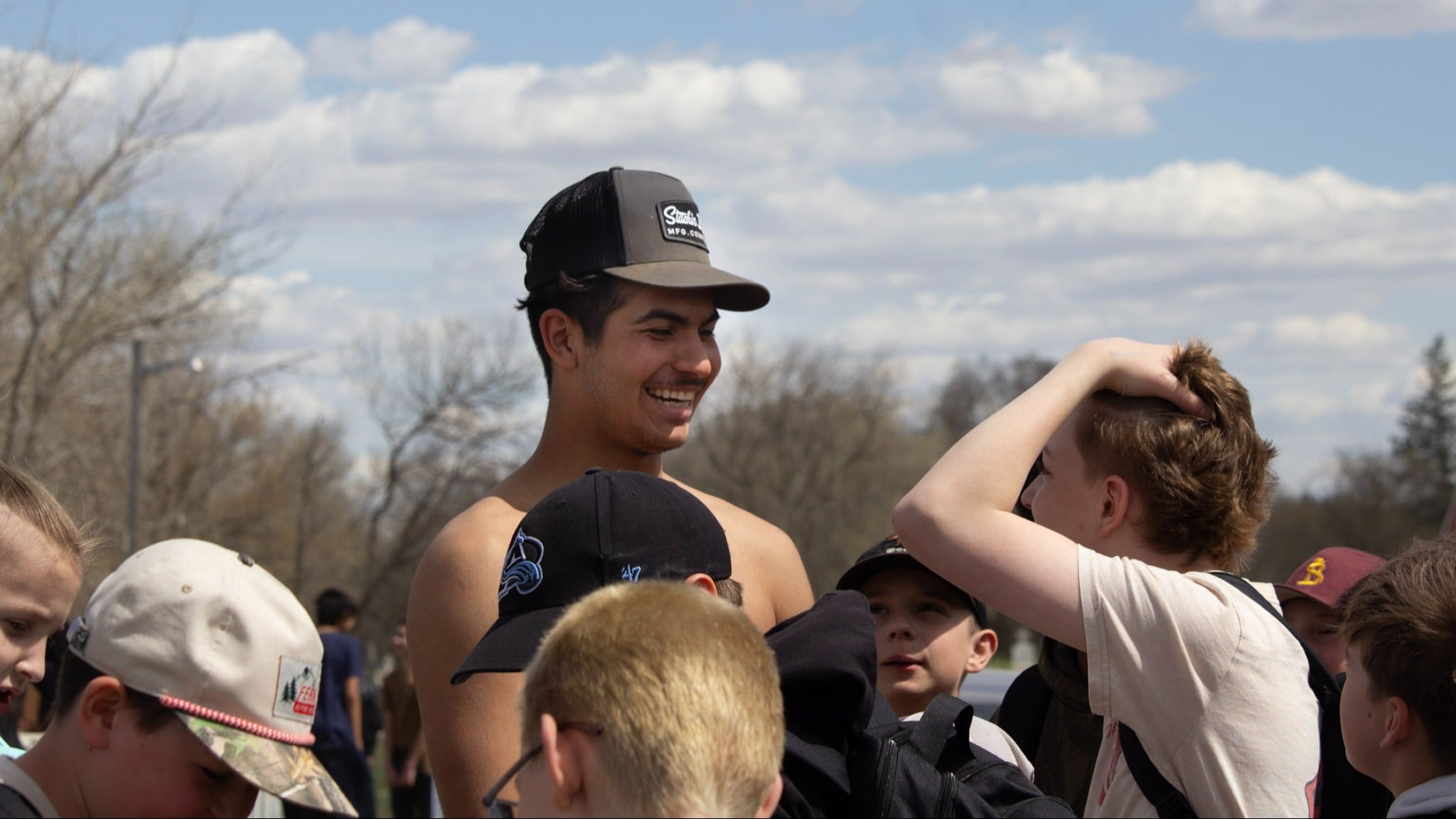Kaleal Jackson interacts with youth following the Indian Relay exhibition.
