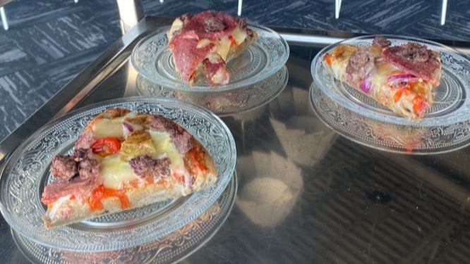 Pizza named 'pinamach' meaning we are grateful in Stoney Nakoda language. Made of wild rice flour, minced moose and buffalo summer sausage.