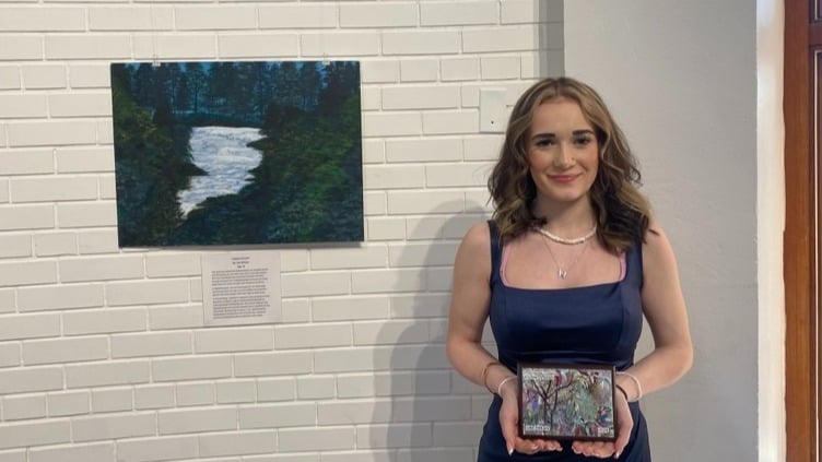 Lyla Dirksen with her painting.