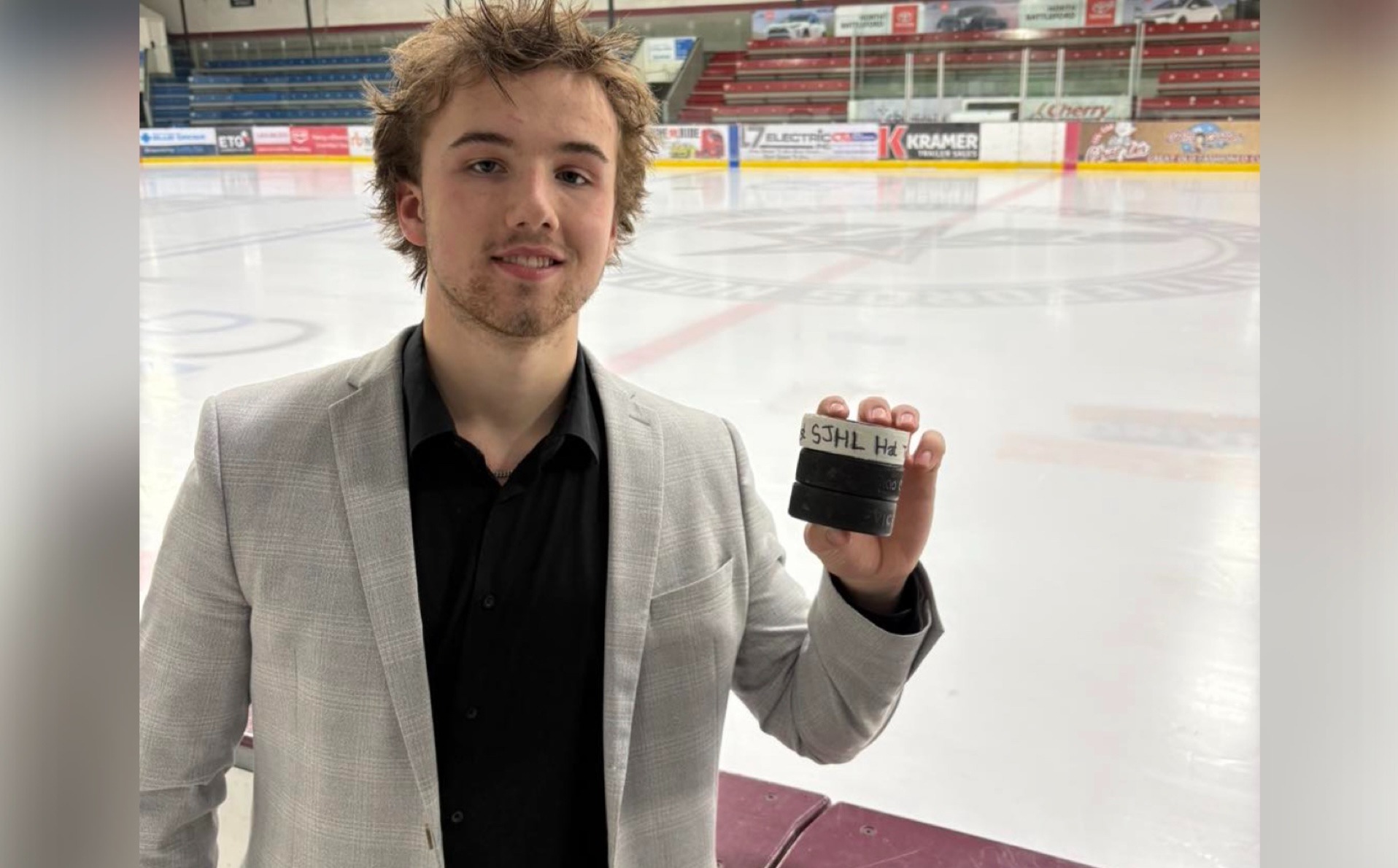 Finlay Klippenstein holds three pucks after recording his first career SJHL hat trick for the Battlefords North Stars against the Flin Flon Bombers on Dec. 12, 2025.
