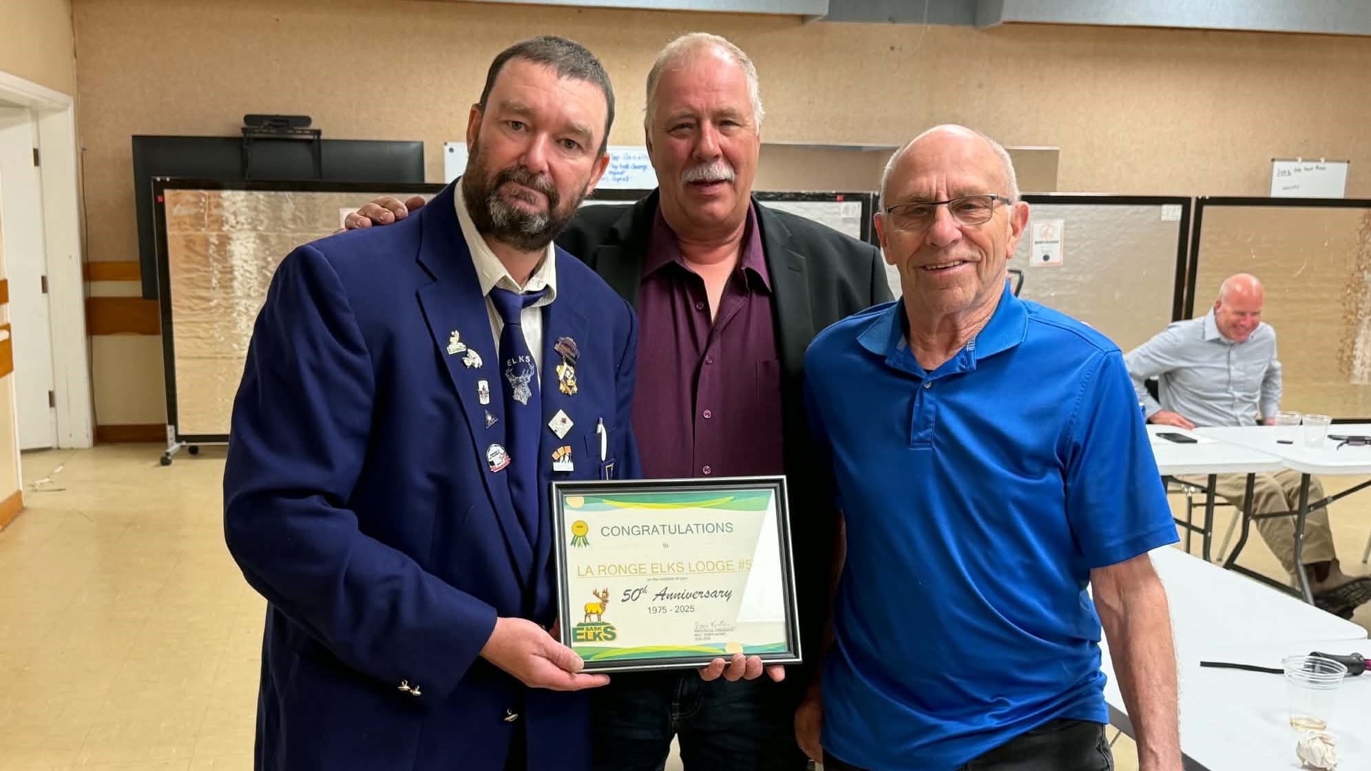 Ron Fiske, far right, was honoured with a large donation in his name on Wednesday.
