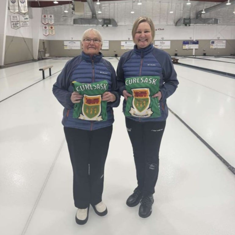 Swiderski and Bibby stand with their Team Saskatchewan jackets after being named as representatives for the Canadian National Two-Person Stick Curling Championship.