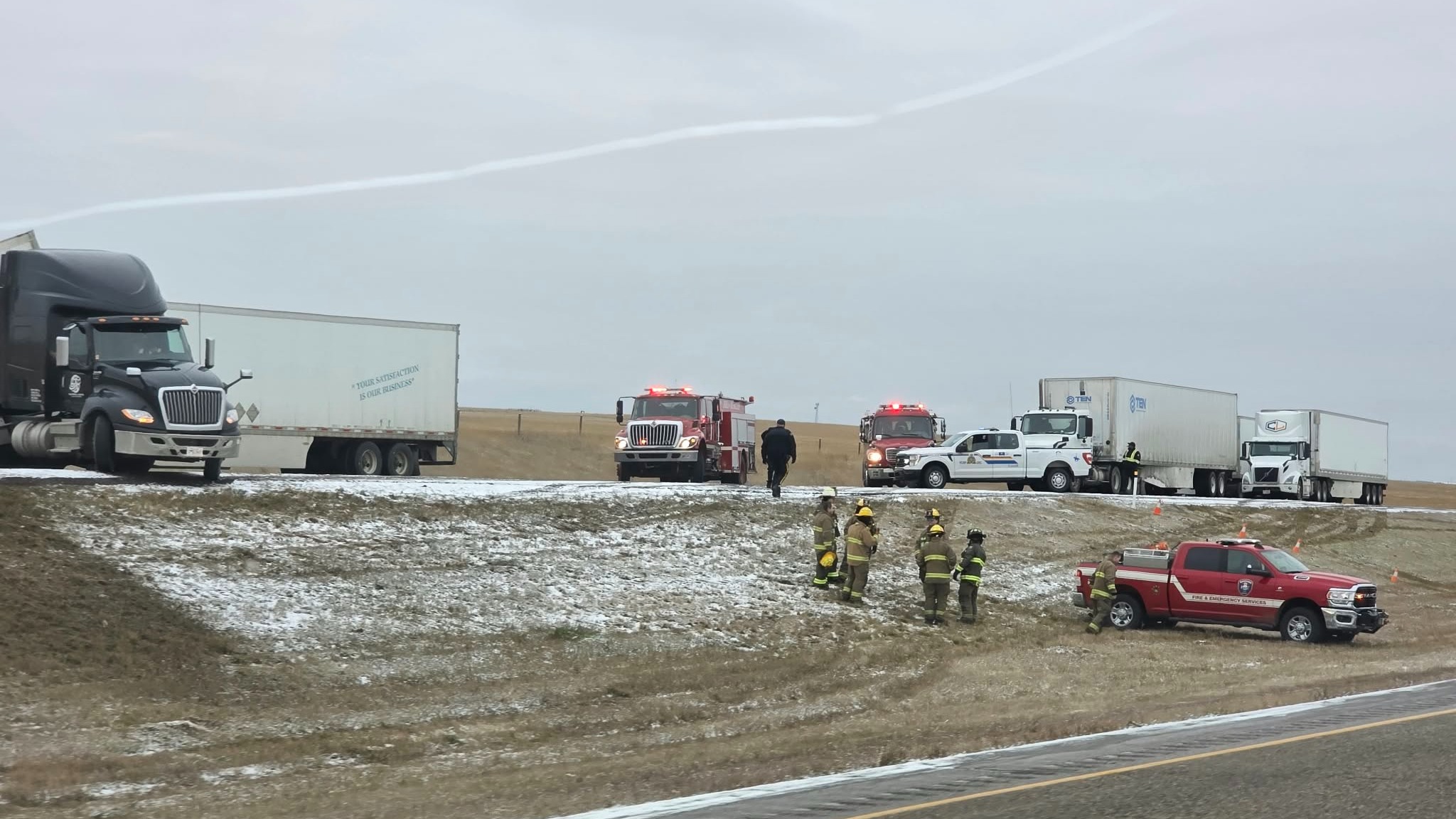 Semi-Truck across Highway 1 near Bassano and emergency crews on site on Thursday morning.