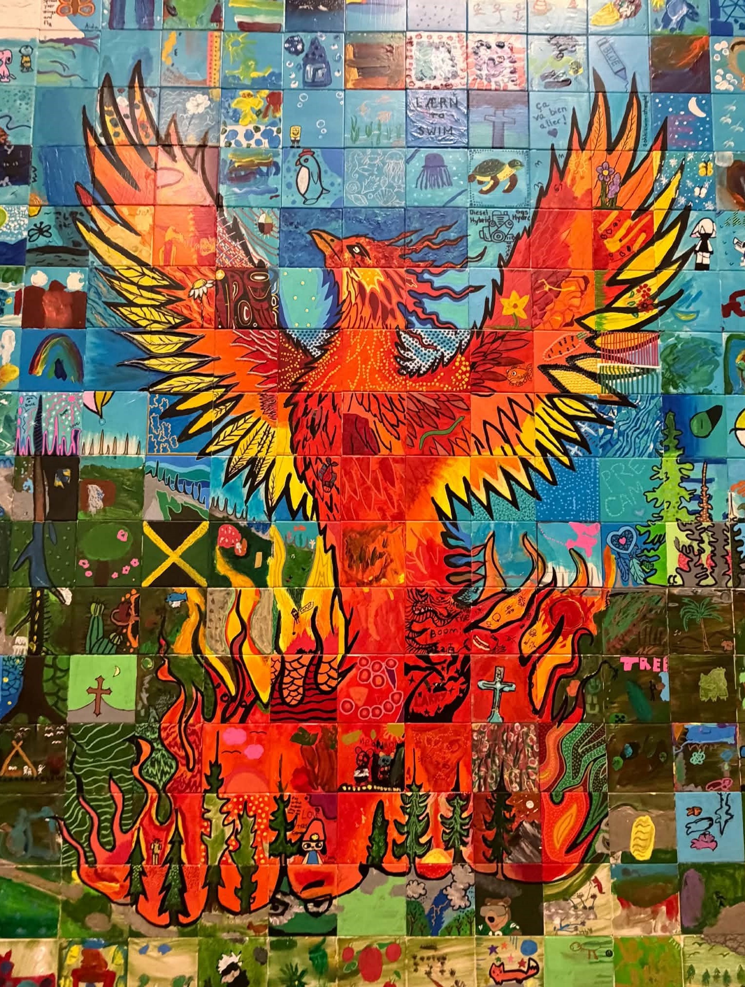 A phoenix in the center of the mosaic symbolizes residents coming back from the ashes of last year's wildfire stronger and more resilient.