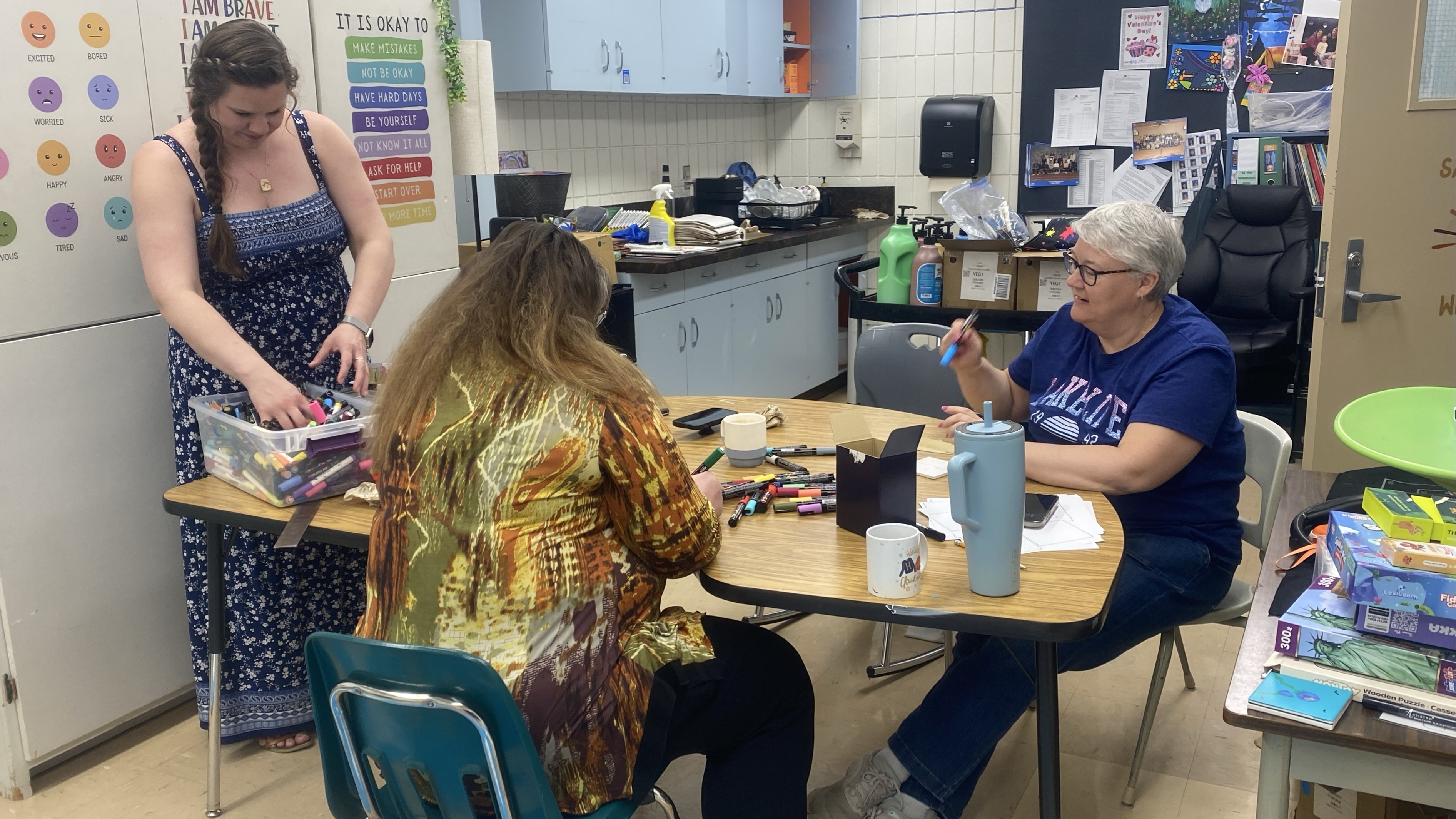 Amanda Hicks, Lori Howe and Kandi Boyes working hard to paint their tiles.