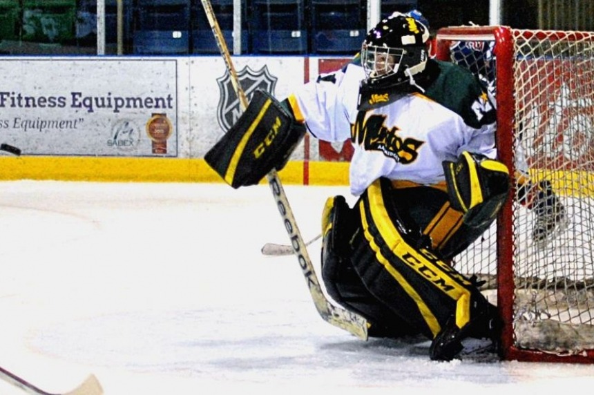 Connor Ingram uses the blocker to turn aside a shot during his AAA debut with the Prince Albert Mintos against the Regina Pat Canadians at the Art Hauser Centre on Nov. 23, 2013. Ingram ended the game with a 33-save shutout, as the Mintos beat the Pat Canadians 2-0.