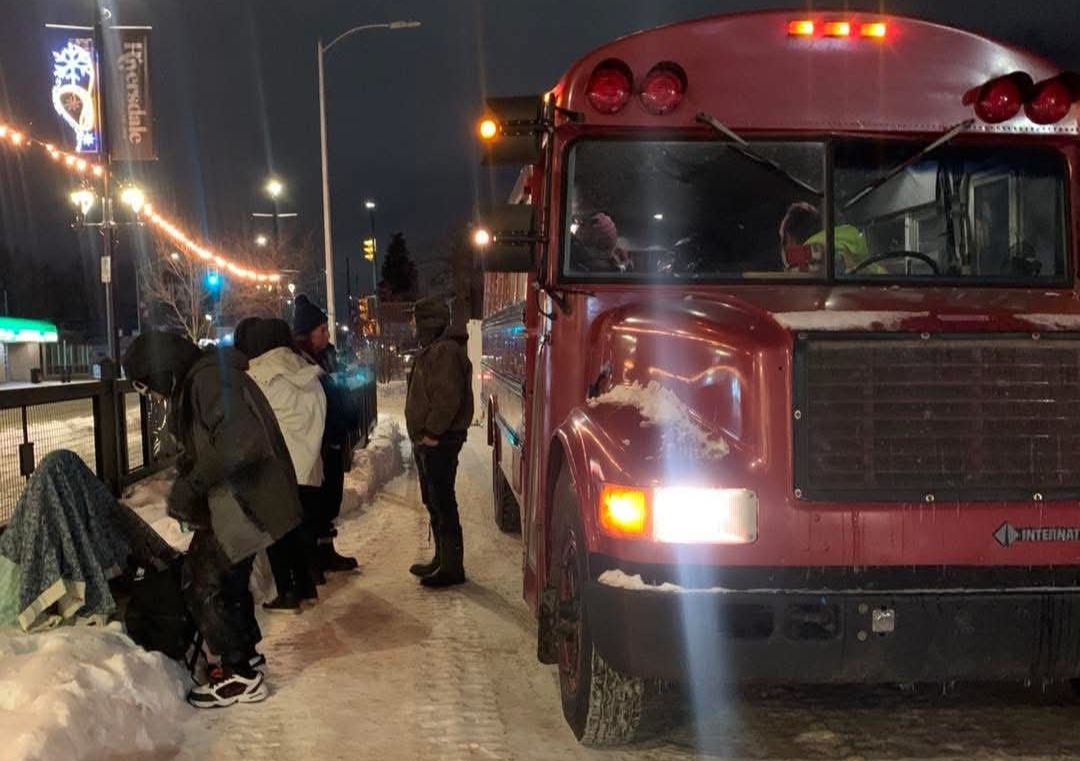 A bus used in the outreach initiative offers people experiencing homelessness a place to warm up, along with soup and winter clothing.