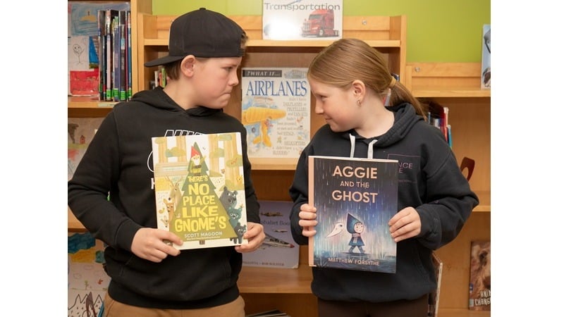 Grade 6 students Dierks Lang (left) and Collyns Lindstrand show off their March Book Madness selections, There’s No Place Like Gnome and Aggie and the Ghost, at Ponoka Elementary School.