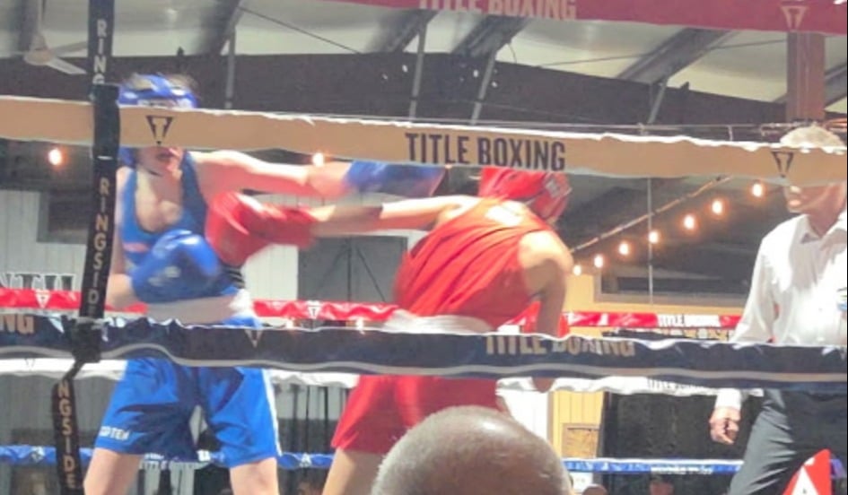 Rapid View’s Havanna Demers, red, faces Vancouver’s Eva Polyakova during their youth 57-kg bout at the Western Canadian Championships in Cochrane, Alta., Feb. 2026. Demers won gold by unanimous decision.