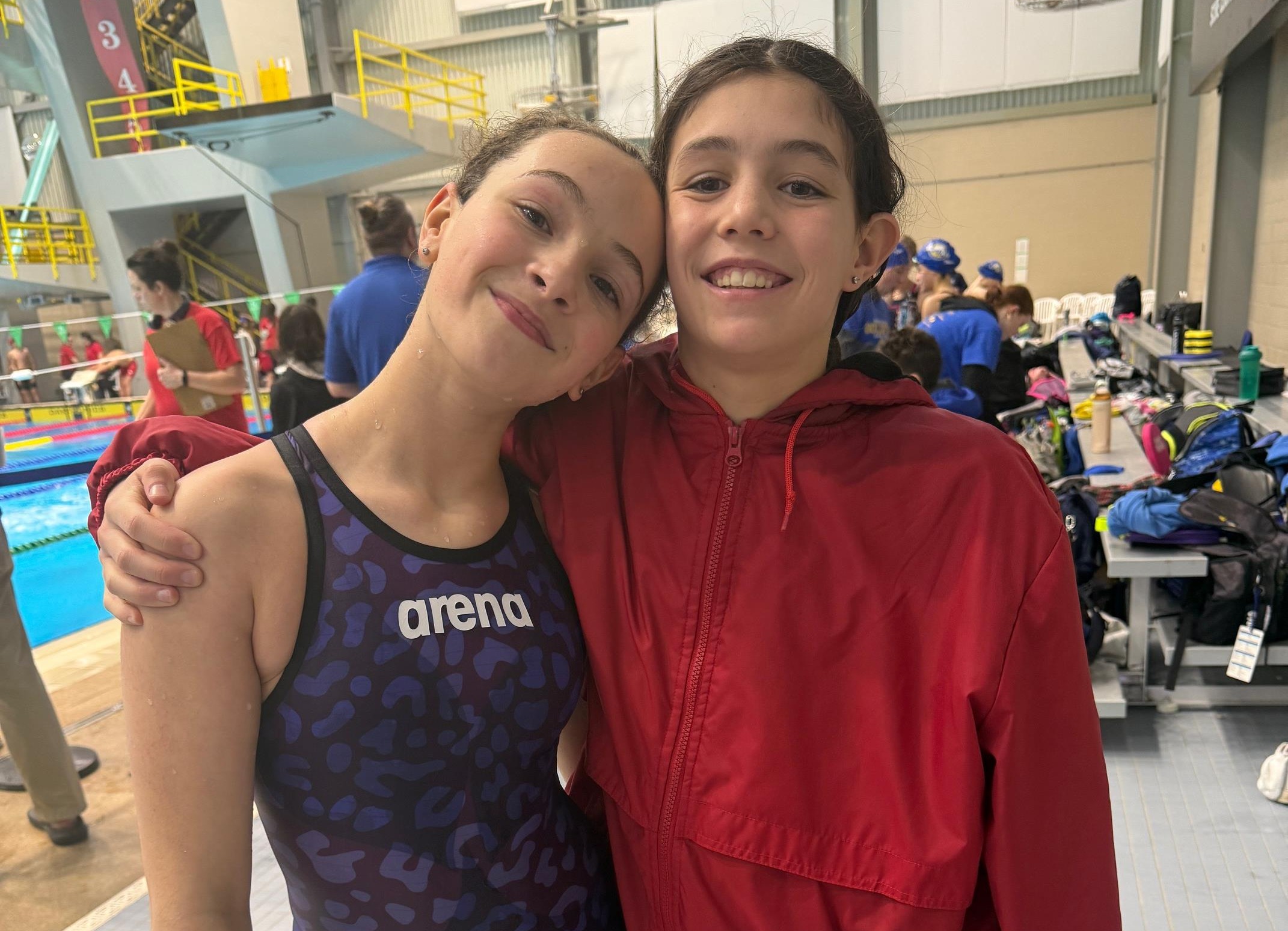 Battlefords Orcas swimmers Sophie de Montarnal, left, and Claire Meiers are shown during the Winter Whiteout AA qualifying meet in Saskatoon earlier this season. Both posted strong personal-best performances at the competition.