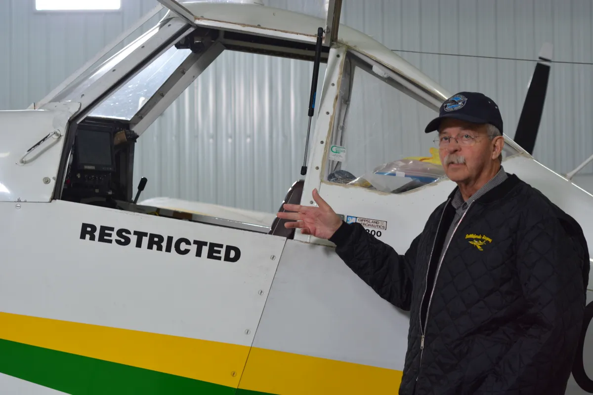Fran de Kock poses with a GippsAero GA200 agricultural training aircraft at Battlefords Airspray in North Battleford.