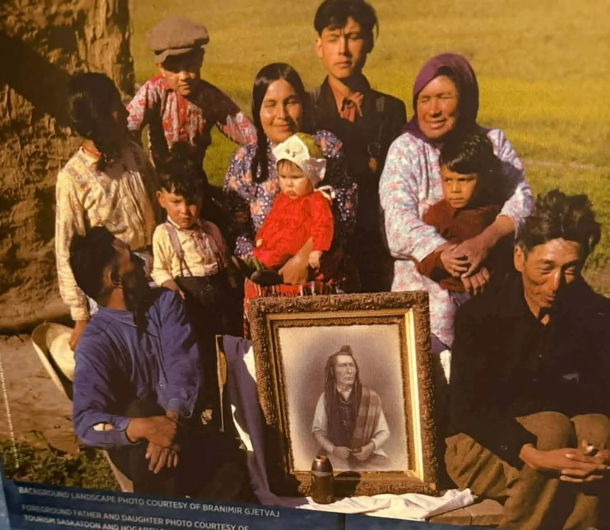 Solomon Bluehorn, lower right, visits with the family of Adam Tootoosis.