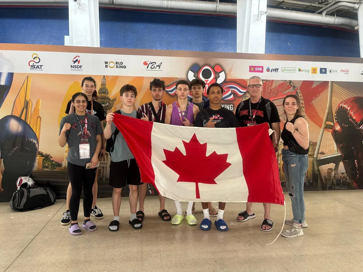 Members of Team Canada pose in front of Huamak Stadium in Bangkok, Thailand during the U19 World Boxing Futures Cup.