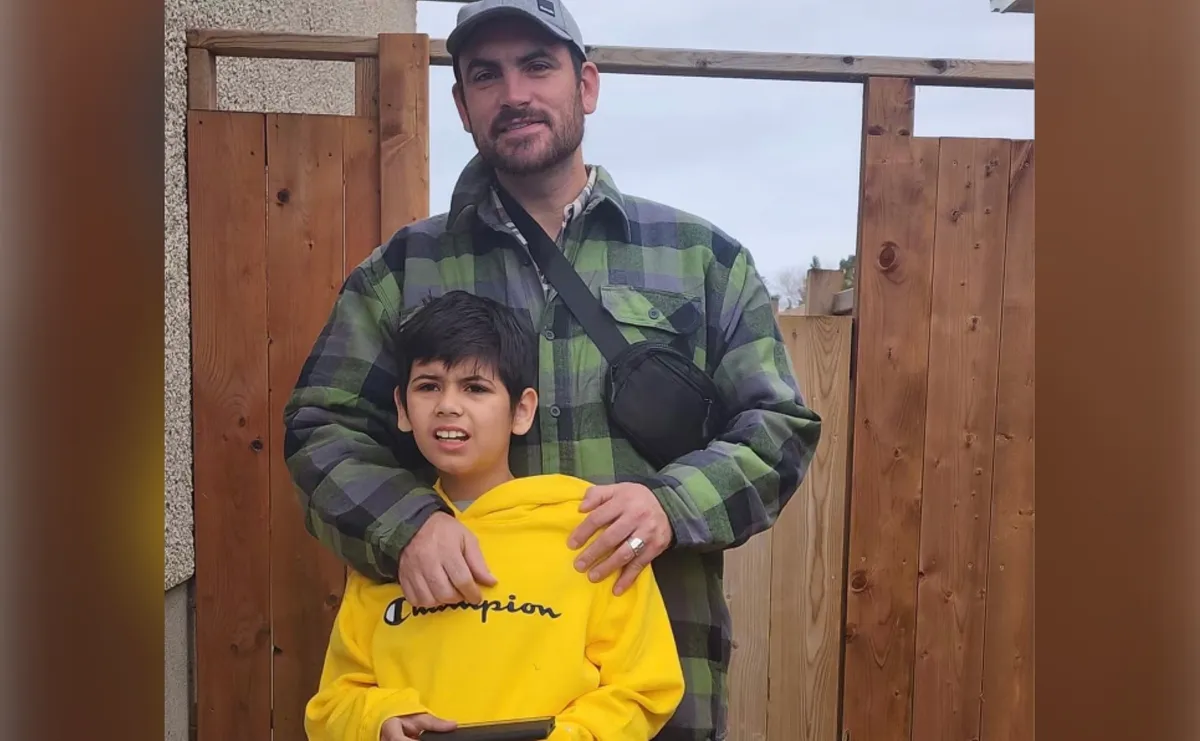 Joshua MacWhirter and his 13-year-old son, Malachi.