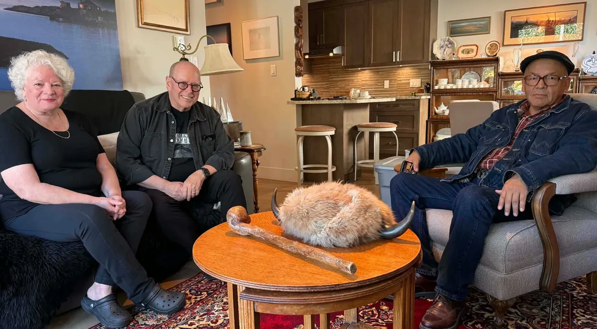 From left, Carol (Burdett) Hewitt, Bob Hewitt and Floyd Favel sit at the Hewitt home in Victoria, B.C., in February 2026 with the historical artifacts.