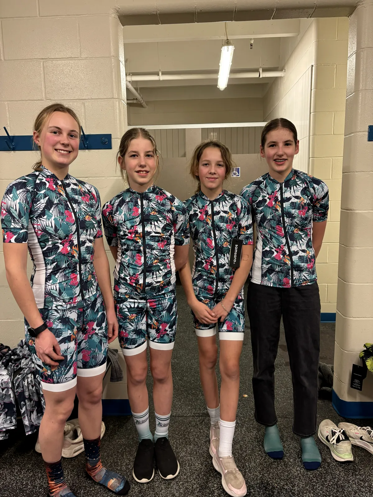 Several Blizzard Speed Skaters trying on their new gear for the first time.