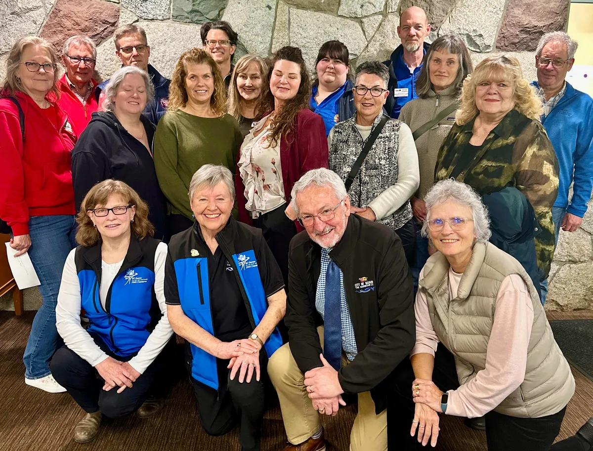 Nanaimo mayor Leonard Krog (front, second from left) with the recipients of $74,376, distributed to ten different local groups from the 55+ BC Games Society.