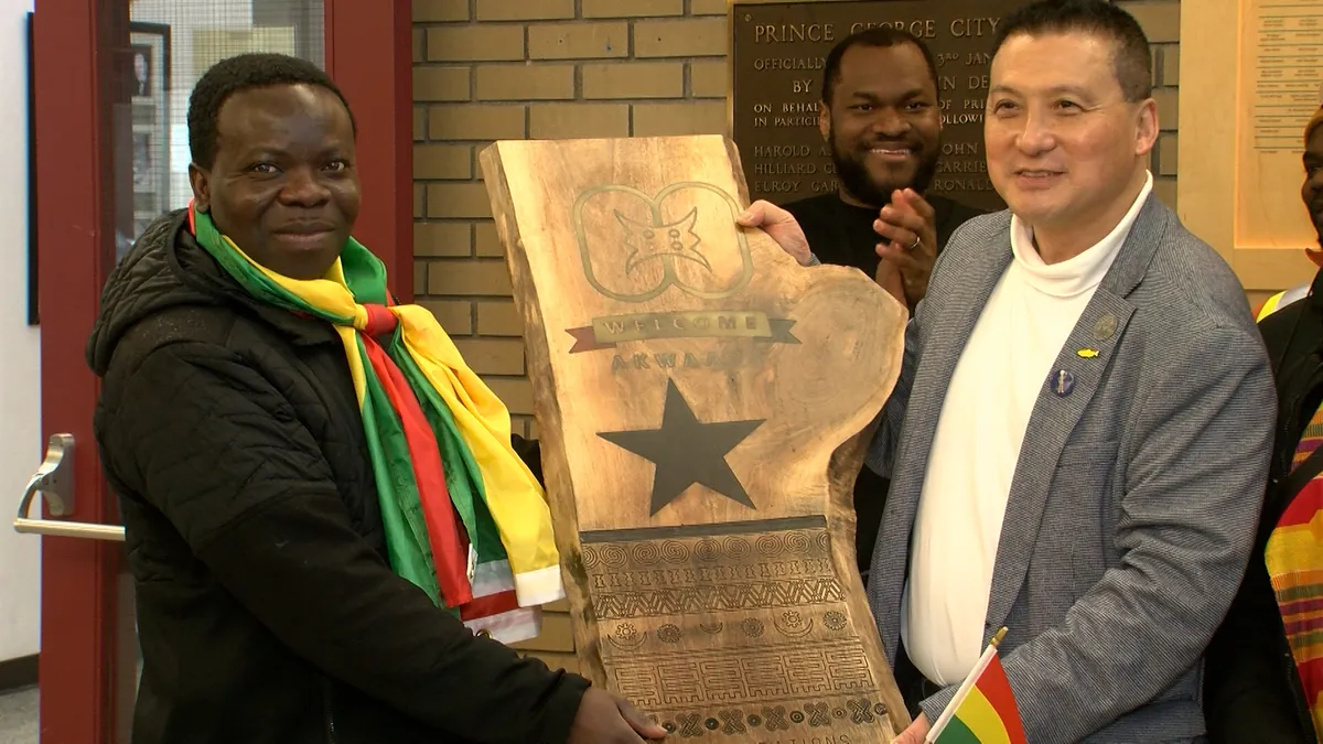 Mayor Simon Yu was gifted this wooden plaque to celebrate the flag raising