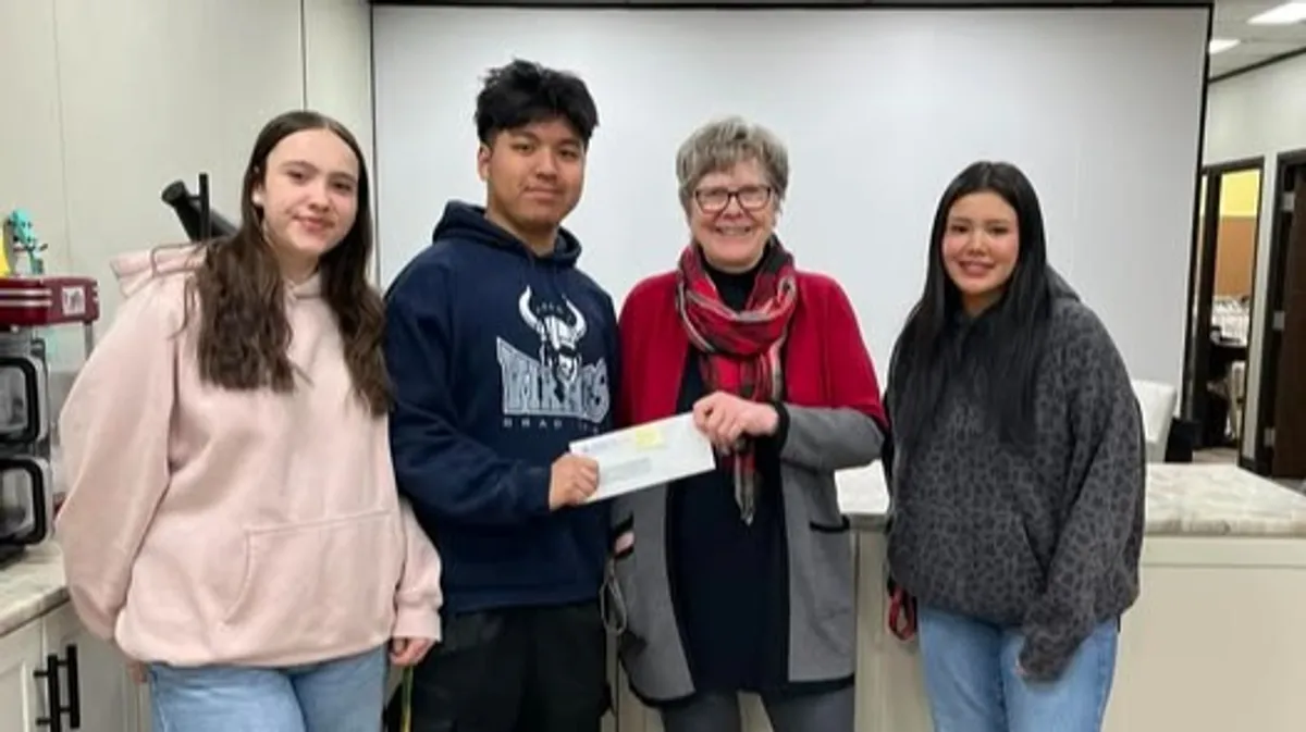 Five Cups Coffee Co owners delivering a donation to Concern For Youth. From left: Carlie, Brendan, Linda, and Bree.