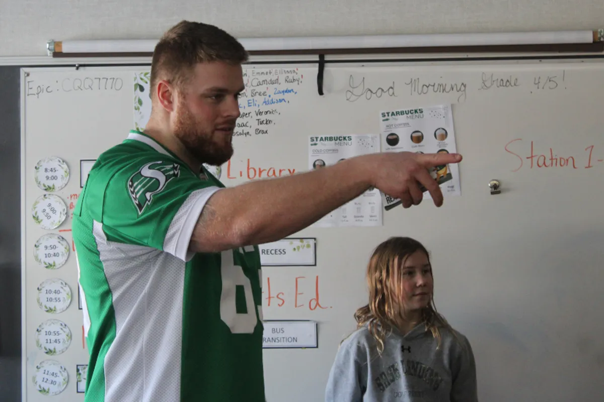 Logan Ferland directs a game of heads up, seven up.