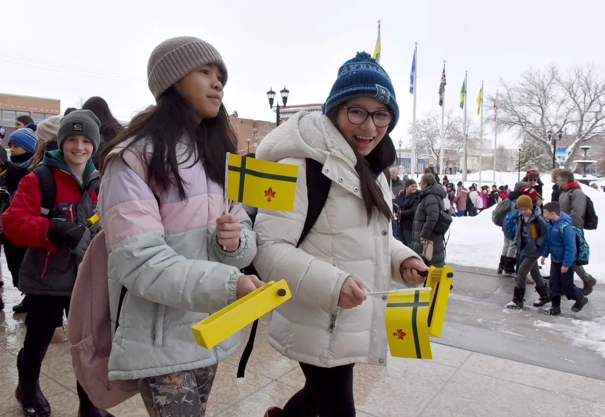 Each student was given a noisemaker and flag to wave as they marched.