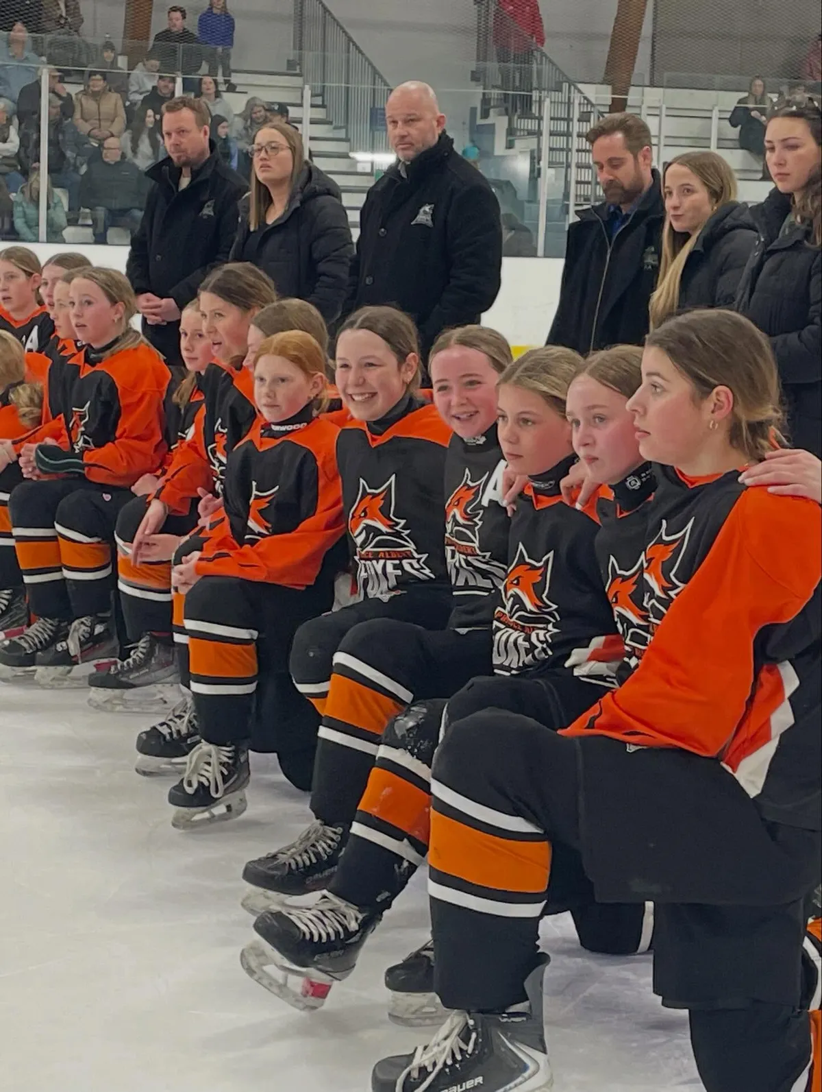 All smiles as the U13 AA Family Pizza Foxes received their title as 2025-26 Provincial Champions.