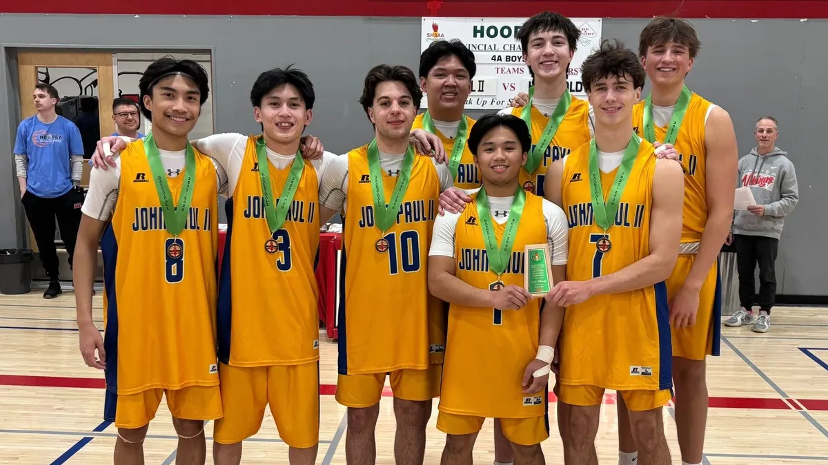 John Paul II has eight boys basketball players graduating, ending off their high school basketball careers with a provincial bronze medal.